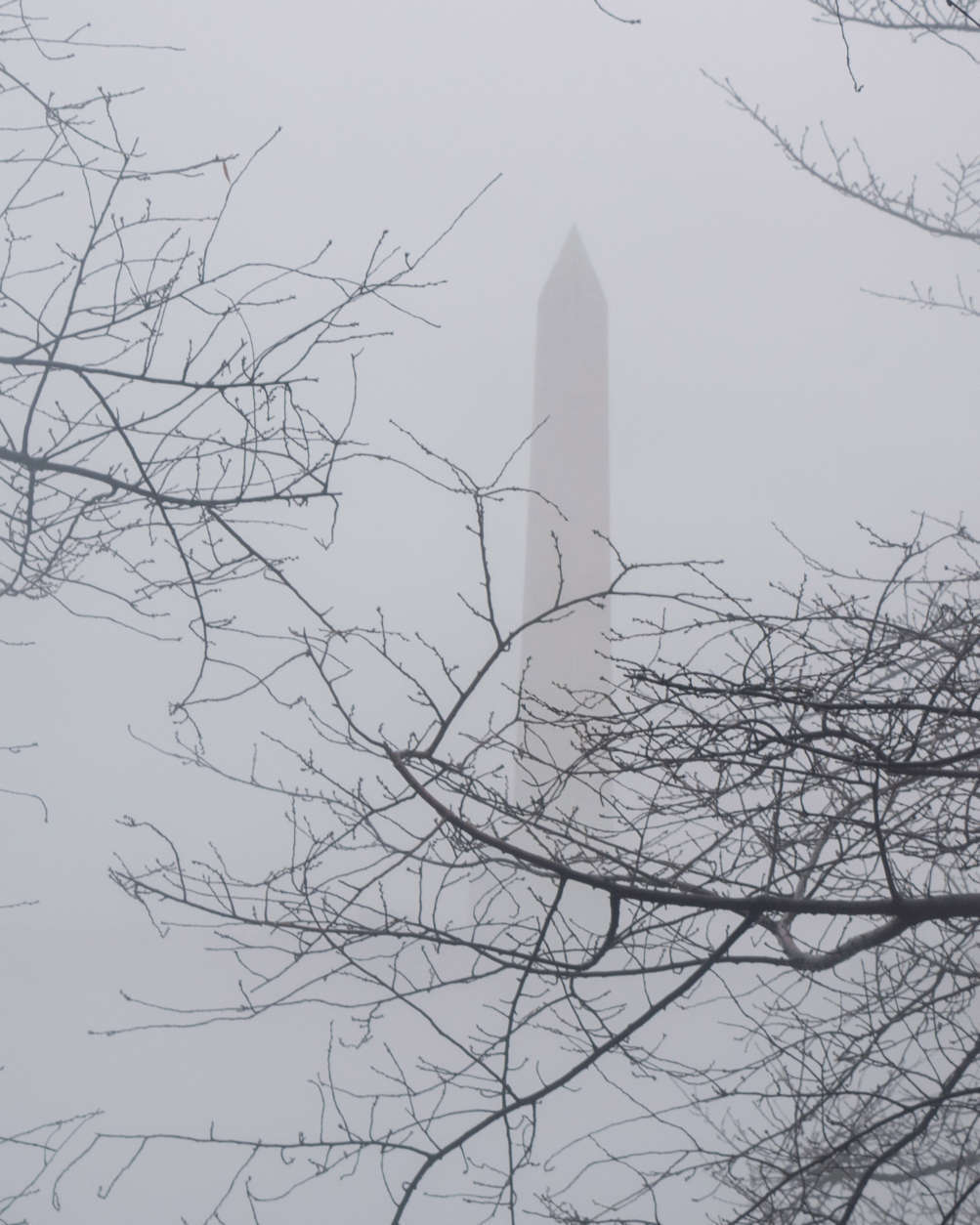 Fog shrouds the Washington Monument on Friday, Jan. 12, 2018. Mild temperatures mixing with cold air above the icy Potomac River created the heavy, ethereal fog. (WTOP/Carlos Prieto)