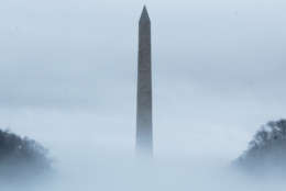 Fog shrouds the base of the Washington Monument on Friday, Jan. 12, 2018. Mild temperatures mixing with cold air above the icy Potomac River created the heavy, ethereal fog. (WTOP/Carlos Prieto)