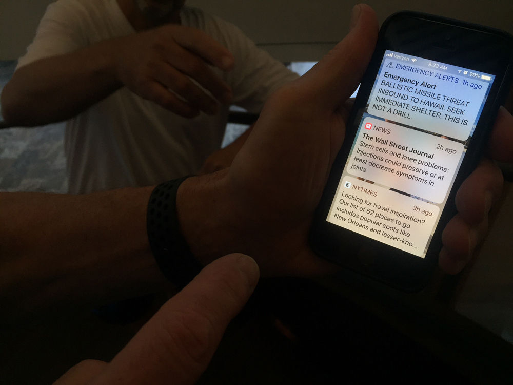 A hotel guest shows WTOP's John Aaron the emergency alert on his phone. (WTOP/John Aaron)