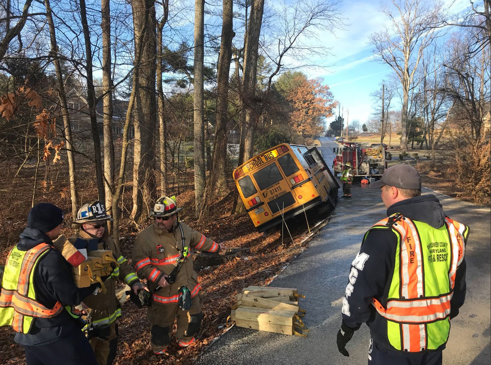 In Montgomery County, Maryland, a school bus with several passengers aboard slid off the road on Tulip Lane at around 8:45 a.m., according to Montgomery County Fire and Rescue spokesman Pete Piringer. All occupants were safely removed from the bus and no one was seriously injured. (Courtesy Montgomery County Fire and Rescue)