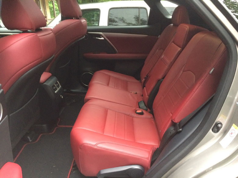 The backseat fits two adults comfortably, with a third possible for shorter trips. (WTOP/Mike Parris)