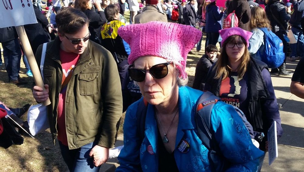 Marchers donned pink hats and carried signs at the 2018 Women's March in D.C. on Saturday. (WTOP/Kathy Stewart)