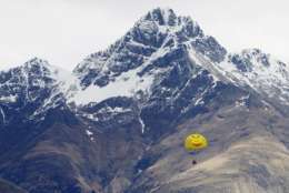 A group of tourists parasail over Lake Wakatipu with the backdrop of the Remarkables mountain range in Queenstown, New Zealand, Thursday, Sept., 15, 2011. (AP Photo/Alastair Grant)
