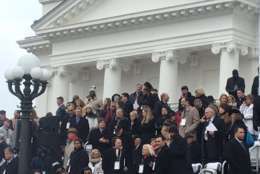 D.C. Mayor Muriel Bowser (top center, purple scarf) also attended the inauguration. (WTOP/Max Smith)