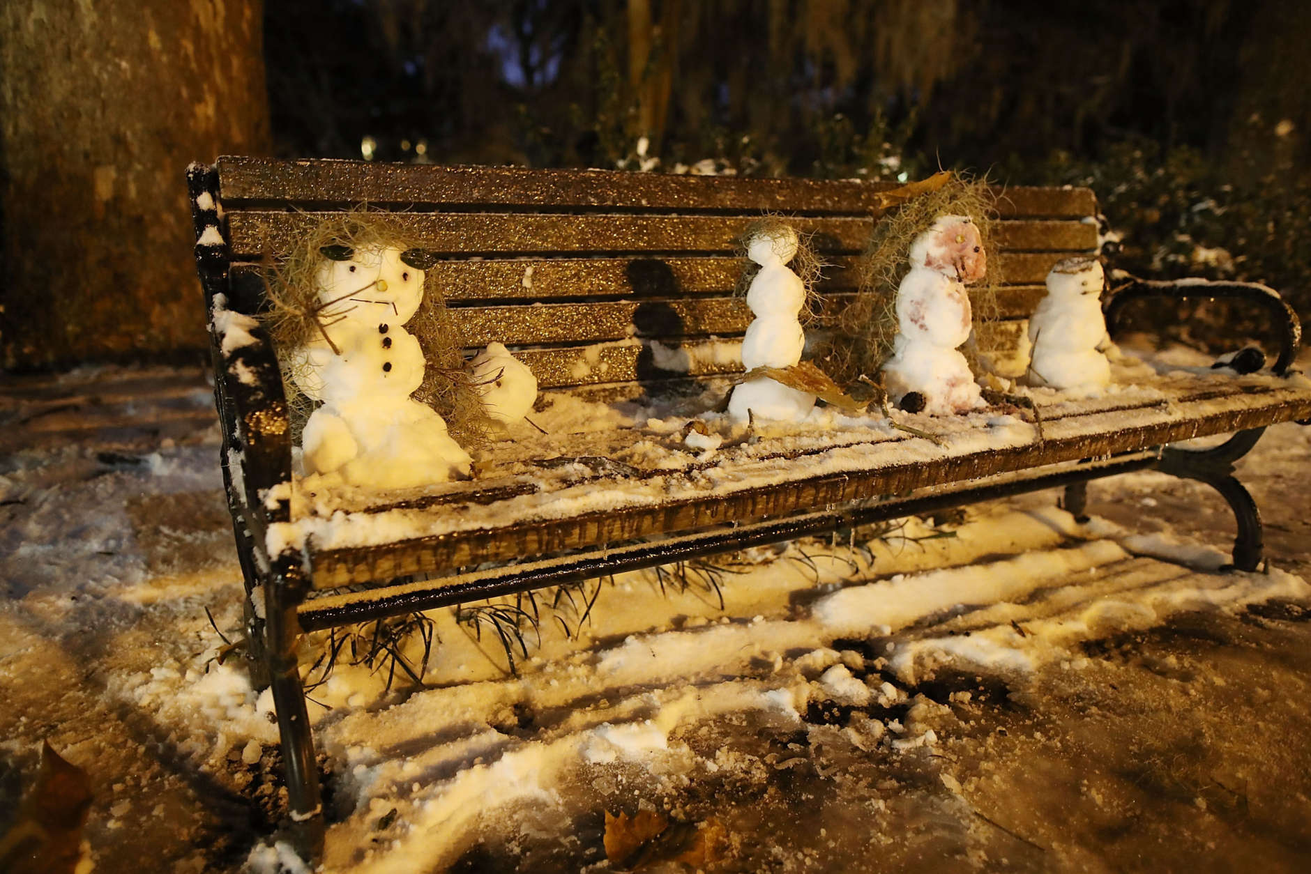 SAVANNAH, GA - JANUARY 04: Little snowmen are seen on a bench in Forsyth Park as snow and cold weather blanket the area on January 4, 2018 in Savannah, Georgia. The extreme winter storm pummeled the Southeastern United States and is moving towards the east coast with frigid temperatures and heavy wind and snow.  (Photo by Joe Raedle/Getty Images)