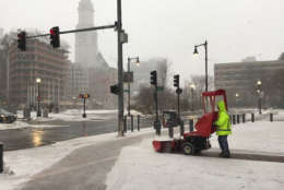 WTOP's Steve Dresner was in Boston Thursday and captured a photo of workers plowing snow from the sidewalks. (WTOP/Steve Dresner)