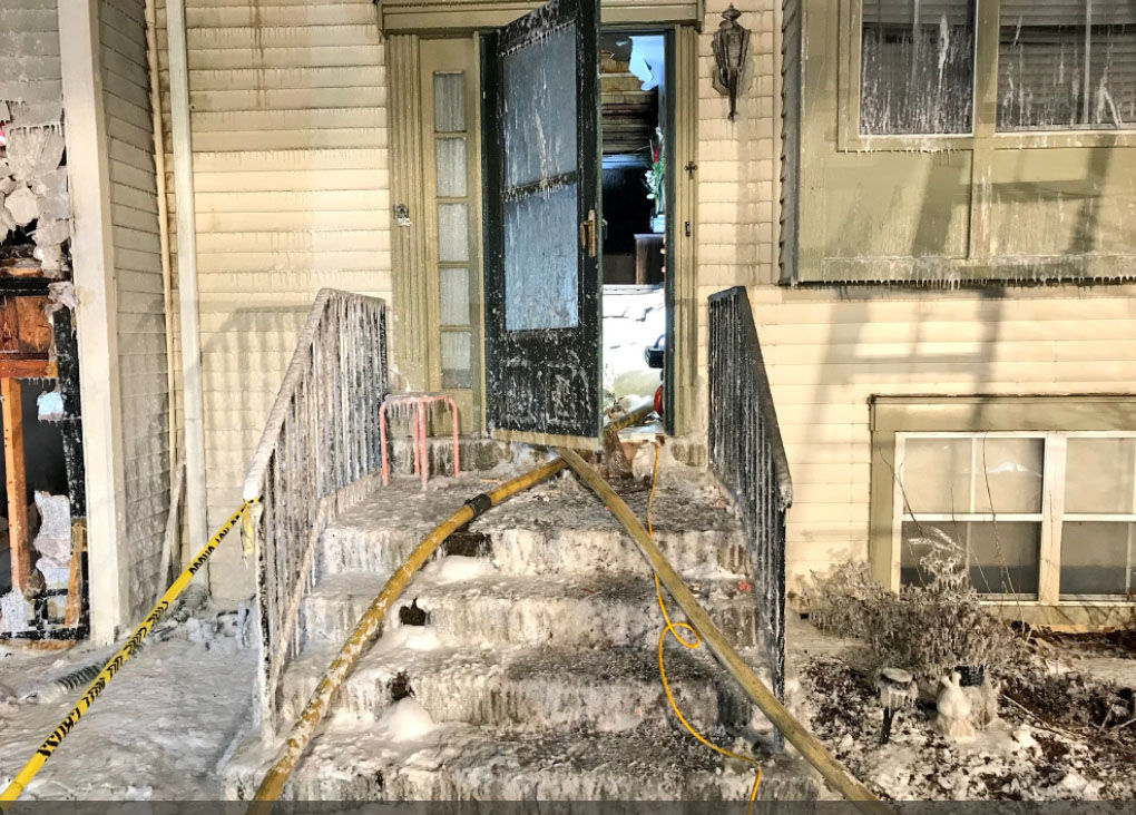 The origin of the fire in a five-row town house unit is the fireplace, where flammable liquid was used to restart a fire and a door was left open. (Courtesy Montgomery County Fire and Rescue)