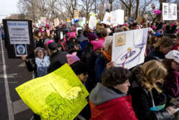 People line up on Central Park West as they wait for the start of a march highlighting equal rights and equality for women Saturday, Jan. 20, 2018, in New York.  The New York protest was among more than 200 such actions planned for the weekend around the world. (AP Photo/Craig Ruttle)