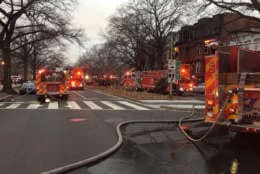 Two people were taken to the hospital after a fire engulfed a three-story town house in Northwest D.C., sending black smoke into the air that was visible for miles. (Courtesy D.C. Fire and EMS)