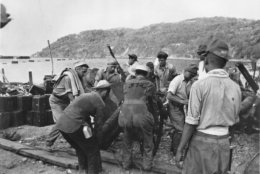 According to the U.S. Army, U.S. Prisoners of War emplace a mountain gun under Japanese guard on the south shore of Corregidor, Philippines. This undated photo was captured from the Japanese during World War II. (AP Photo)