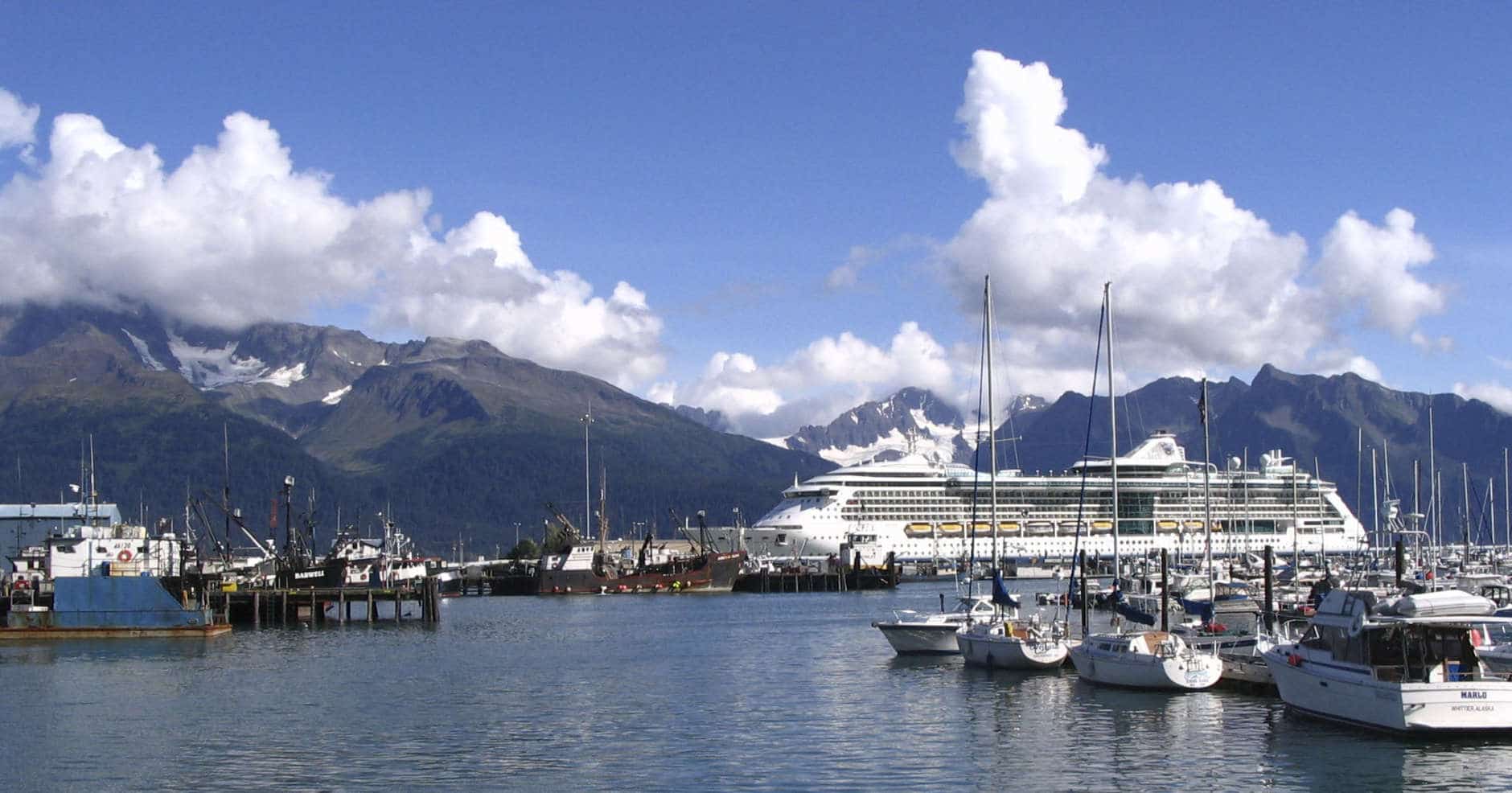 ** FOR STORY SLUGGED CRUCEROS **  Royal Caribbean's "Radiance of the Seas" is shown in Seward, Alaska, in this Sept. 7, 2007 photo, dwarfing the fishing boats in the port. (AP Photo/Beth J. Harpaz)