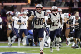 New England Patriots wide receiver Danny Amendola (80), wide receiver Phillip Dorsett (13) and the rest of the team, run on the field as they are introduced before the NFL Super Bowl 52 football game against the Philadelphia Eagles, Sunday, Feb. 4, 2018, in Minneapolis. (AP Photo/Frank Franklin II)