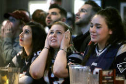 Kathleen Doherty, center, of Woburn, Mass., reacts with other fans at a Boston bar while watching the New England Patriots' final drive during the first half of the NFL Super Bowl 52 football game between the Patriots and the Philadelphia Eagles in Minneapolis, Sunday, Feb. 4, 2018. (AP Photo/Steven Senne)
