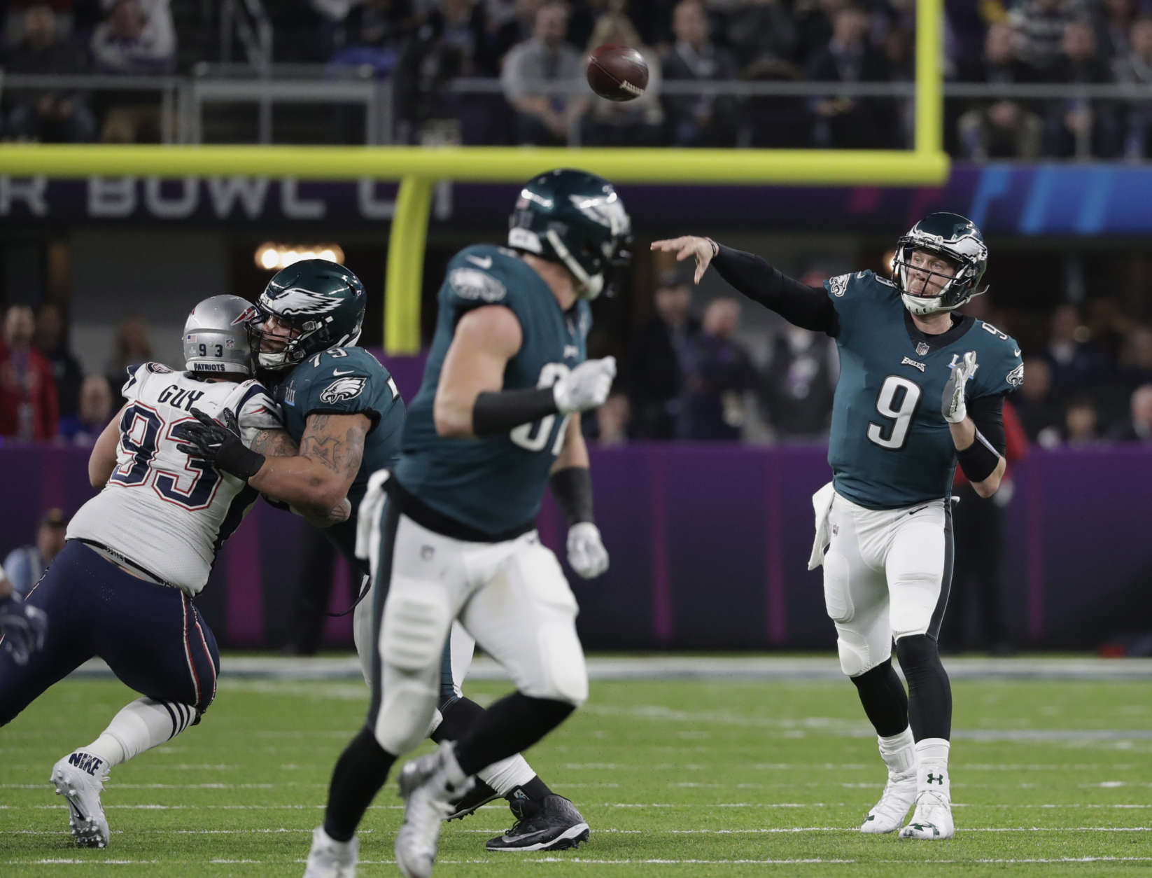 Philadelphia Eagles quarterback Nick Foles (9) throws against the New England Patriots, during the second half of the NFL Super Bowl 52 football game, Sunday, Feb. 4, 2018, in Minneapolis. (AP Photo/Tony Gutierrez)