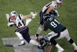 New England Patriots running back Rex Burkhead, left, runs against the Philadelphia Eagles during the second half of the NFL Super Bowl 52 football game Sunday, Feb. 4, 2018, in Minneapolis. (AP Photo/Eric Gay)