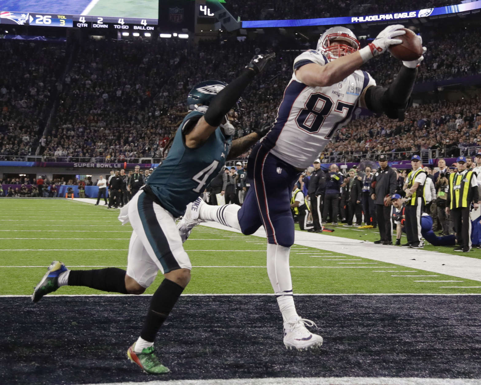 New England Patriots' Rob Gronkowski (87) makes a touchdown reception against Philadelphia Eagles cornerback Ronald Darby (41), during the second half of the NFL Super Bowl 52 football game, Sunday, Feb. 4, 2018, in Minneapolis. (AP Photo/Chris O'Meara)