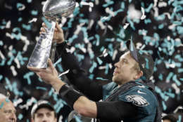 Philadelphia Eagles' Nick Foles holds up the Vince Lombardi Trophy after the NFL Super Bowl 52 football game against the New England Patriots, Sunday, Feb. 4, 2018, in Minneapolis. The Eagles won 41-33. (AP Photo/Chris O'Meara)