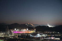 The Olympic Stadium is illuminated prior to the closing ceremony of the 2018 Winter Olympics in Pyeongchang, South Korea, Sunday, Feb. 25, 2018. (AP Photo/Felipe Dana)