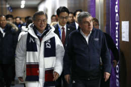 South Korean President Moon Jae-in, left, and International Olympic Committee President Thomas Bach walk into a viewing suite at the closing ceremony of the 2018 Winter Olympics in Pyeongchang, South Korea, Sunday, Feb. 25, 2018. (AP Photo/Patrick Semansky, Pool)