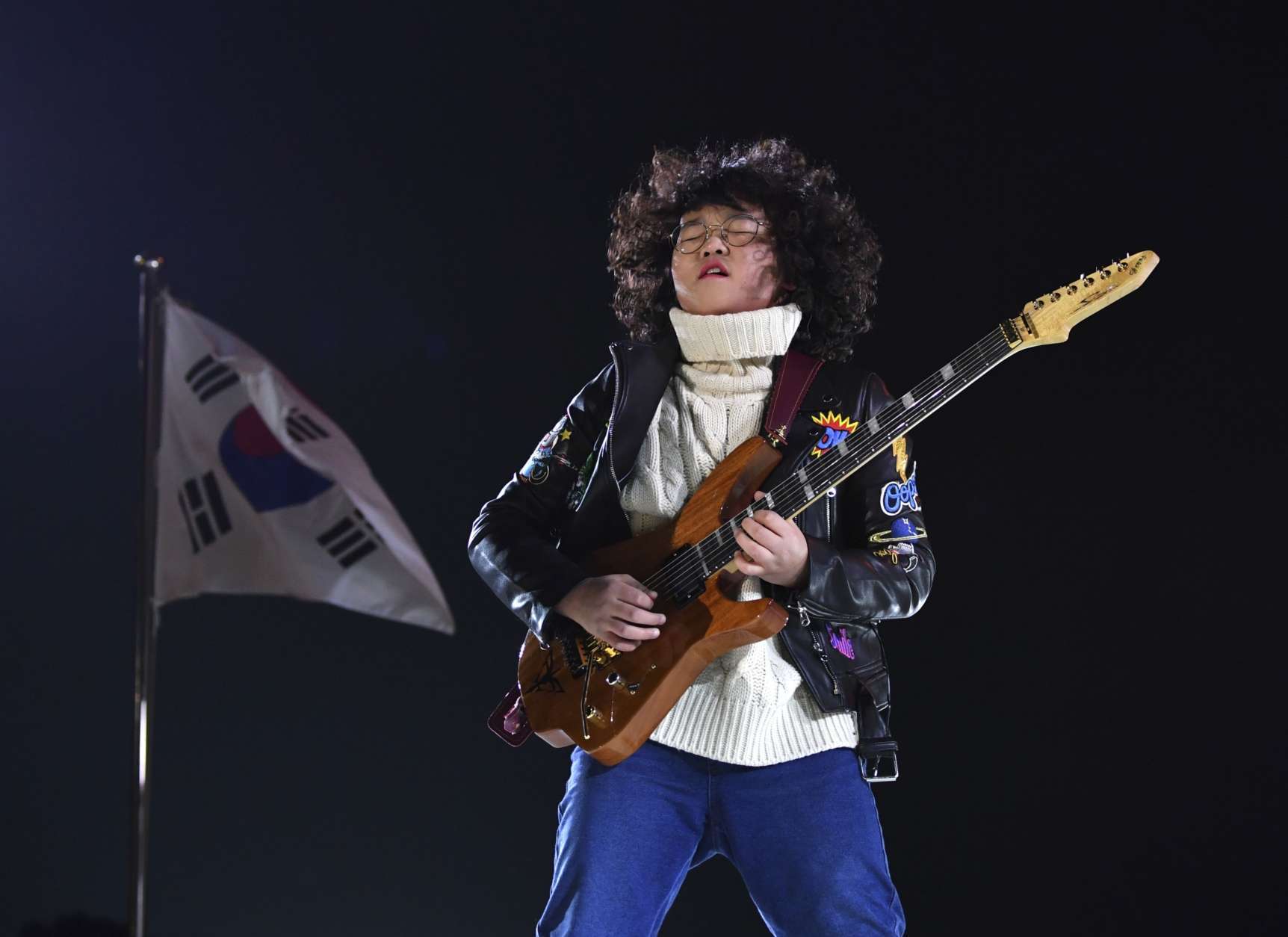 Thirteen-year-old guitarist Yang Tae-hwan plays a variation on 'Winter' from Vivaldi's The Four Seasons, during the closing ceremony of the 2018 Winter Olympics in Pyeongchang, South Korea, Sunday, Feb. 25, 2018. (Christof Stache/Pool Photo via AP)