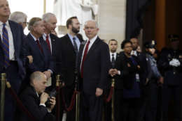Attorney General Jeff Sessions, center, talks to Sen. Lindsay Graham, R-S.C., and others, as they wait for the ceremony to begin honoring Reverend Billy Graham in the Rotunda of the U.S. Capitol building, Wednesday, Feb. 28, in Washington. (AP Photo/Evan Vucci)