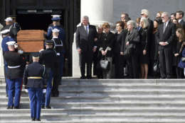 The family of Rev. Billy Graham watches as the casket of Rev. Billy Graham is carried up the steps of the U.S. Capitol in Washington, Wednesday, Feb. 28, 2018, where it will lie in honor in the Rotunda. It's a rare honor for a private citizen to lie in honor at the Capitol. Graham died Wednesday in his sleep at his North Carolina home. He was 99. (AP Photo/Susan Walsh, Pool)