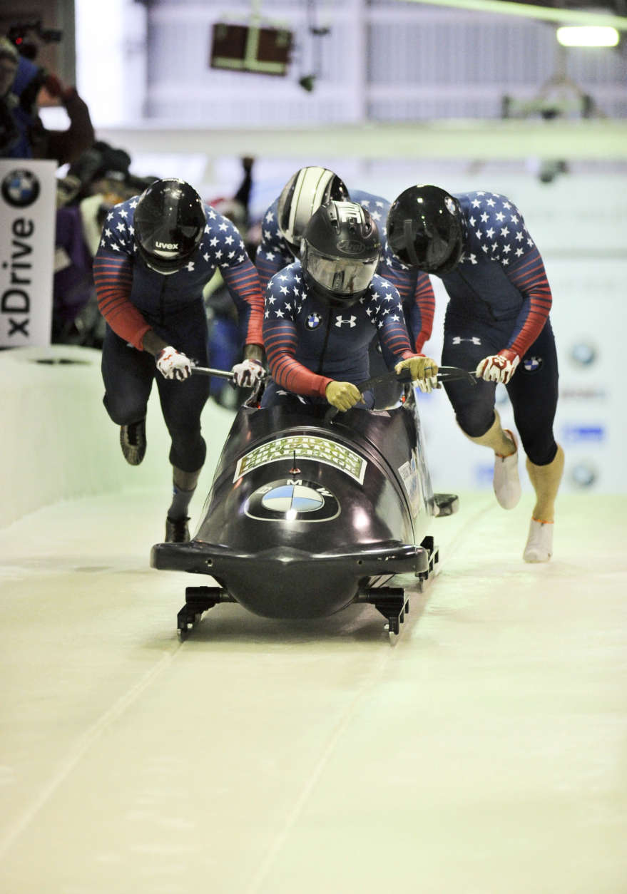 Driver Elana Taylor Meyers with Alex Harrison, Nicholas Taylor and brakeman Hakeem Abdul-Saboor, of the United States Exhibition team,
take part in the four-man bobsled World Cup race on Saturday, Dec. 17, 2016, in Lake Placid, N.Y. (AP Photo/Hans Pennink)