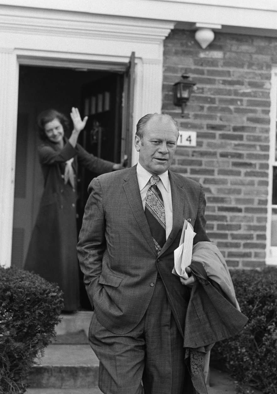 Vice President Gerald Ford gets a wave from his wife Betty early Friday as he left their home in Alexandria on Dec. 7, 1973.  It will be his first full day in his new position following formal swearing in ceremonies on Thursday evening in the House of Representatives chamber. (AP Photo)