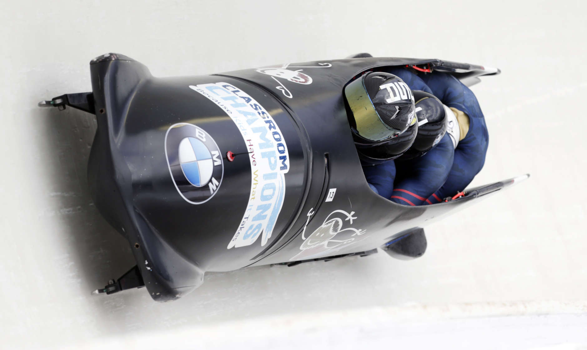 Driver Codie Bascue with David Cremin, Nathan Gilsleider and brakeman Hakeem Abdul-Saboor compete in the four-man bobsled World Cup race on Saturday, Jan. 9, 2016, in Lake Placid, N.Y. (AP Photo/Mike Groll)
