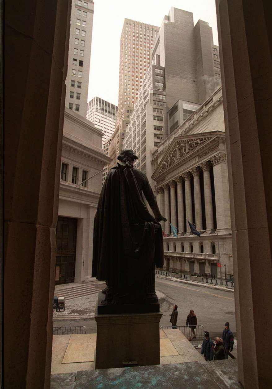 **ADVANCE FOR FRIDAY, FEB. 1--FILE** A bronze statue of George Washington looks out along Broad St. and the New York Stock Exchange on Presidents' Day in this Feb. 19, 1996 file photo, from the steps of New York's Federal Hall, where the nation's first president was sworn into office on April 30, 1789. (AP Photo/Ed Bailey, file)