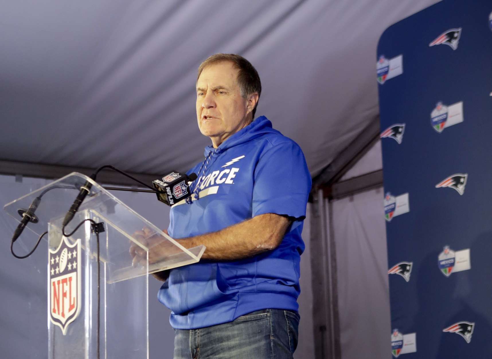 New England Patriots head coach Bill Belichick wears an Air Force sweatshirt as he speaks during a news conference after an NFL football game against the Oakland Raiders Sunday, Nov. 19, 2017, in Mexico City. (AP Photo/Rebecca Blackwell)