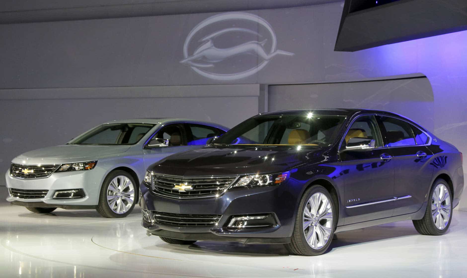 Two 2013 Chevrolet Impalas are unveiled at the New York International Auto Show, in New York's Javits Center,  Wednesday, April 4, 2012. General Motors Co.'s Chevrolet brand is trying to resuscitate sales of big sedans with a sleek, new version of the Impala. (AP Photo/Richard Drew)
