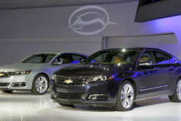 Two 2013 Chevrolet Impalas are unveiled at the New York International Auto Show, in New York's Javits Center,  Wednesday, April 4, 2012. General Motors Co.'s Chevrolet brand is trying to resuscitate sales of big sedans with a sleek, new version of the Impala. (AP Photo/Richard Drew)