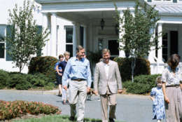 Vice President George Bush, left, walks with his running Sen. Dan Quayle of Indiana, prior to a lunch Bush gave for Quayle and their families at the vice presidents residence in Washington on Sept. 11, 1988. (AP Photo/Charles Tasnadi)