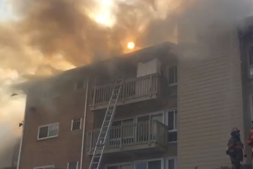 Fire tore through a building in the Fireside Park apartments, in Rockville, Maryland, Friday afternoon. (Courtesy Montgomery County Fire and Rescue)