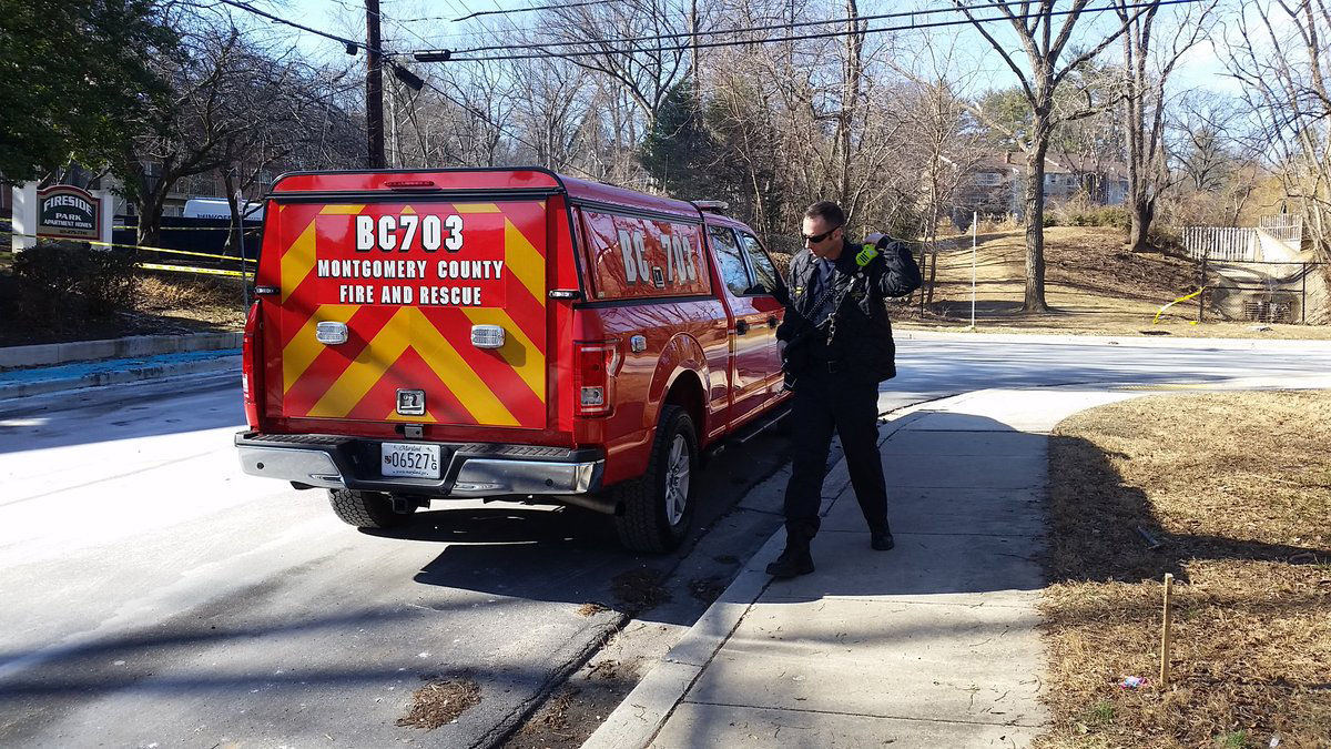 In the wake of the fire, Montgomery County firefighters canvased the neighborhood to check smoke alarms and talk to residents about fire safety. (WTOP/Kathy Stewart)