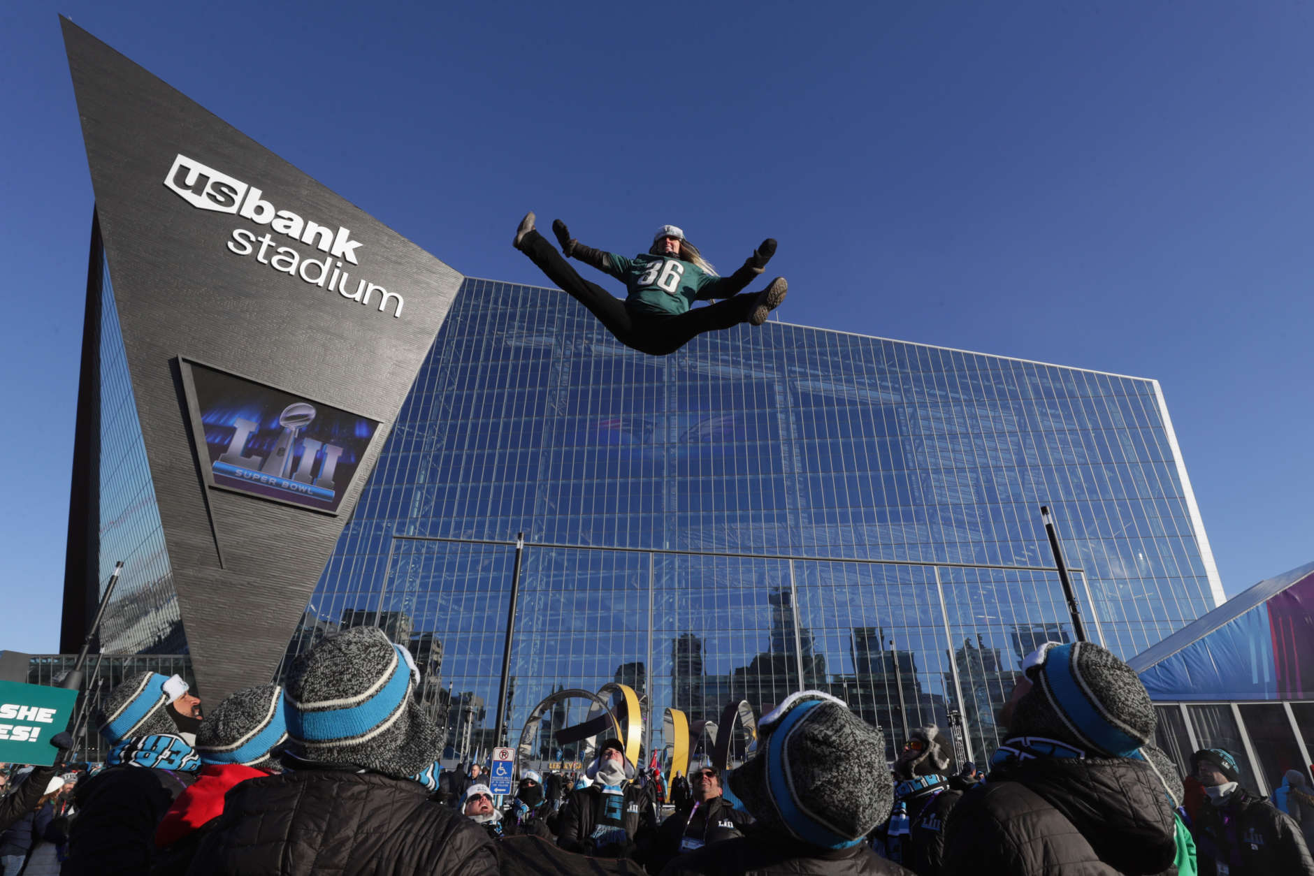MINNEAPOLIS, MN - FEBRUARY 04:  A fan is thrown in the air outside the stadium prior to Super Bowl LII between the New England Patriots and the Philadelphia Eagles at U.S. Bank Stadium on February 4, 2018 in Minneapolis, Minnesota.  (Photo by Streeter Lecka/Getty Images)