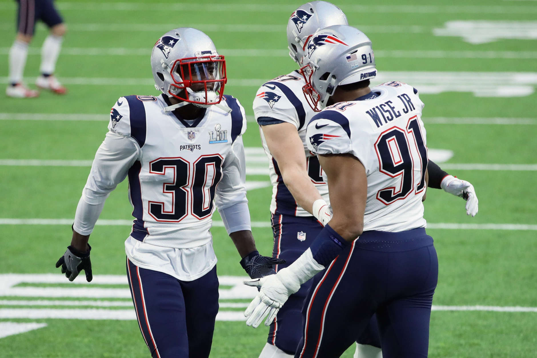 MINNEAPOLIS, MN - FEBRUARY 04:  Duron Harmon #30, Rob Gronkowski #87 and Deatrich Wise #91 of the New England Patriots warm up prior to Super Bowl LII against the Philadelphia Eagles at U.S. Bank Stadium on February 4, 2018 in Minneapolis, Minnesota.  (Photo by Jonathan Daniel/Getty Images)