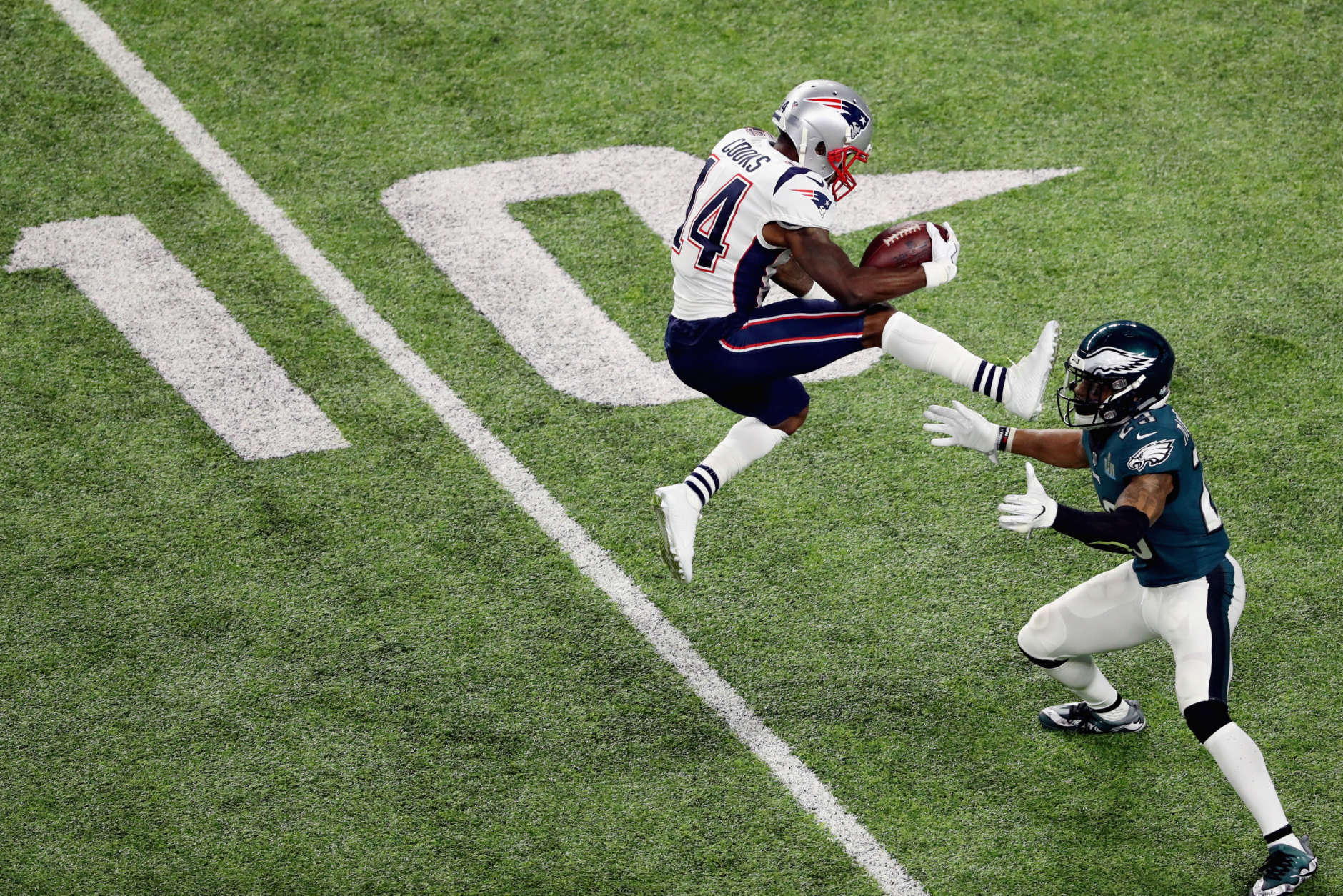 MINNEAPOLIS, MN - FEBRUARY 04:  Brandin Cooks #14 of the New England Patriots is stopped by Rodney McLeod #23 of the Philadelphia Eagles as he attempts to leap over the tackle try during the second quarter of Super Bowl LII at U.S. Bank Stadium on February 4, 2018 in Minneapolis, Minnesota.  (Photo by Christian Petersen/Getty Images)