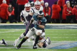 MINNEAPOLIS, MN - FEBRUARY 04:  Derek Barnett #96 of the Philadelphia Eagles recovers the ball after teammate Brandon Graham #55 sacked Tom Brady #12 of the New England Patriots in the fourth quarter of Super Bowl LII at U.S. Bank Stadium on February 4, 2018 in Minneapolis, Minnesota.  (Photo by Jonathan Daniel/Getty Images)