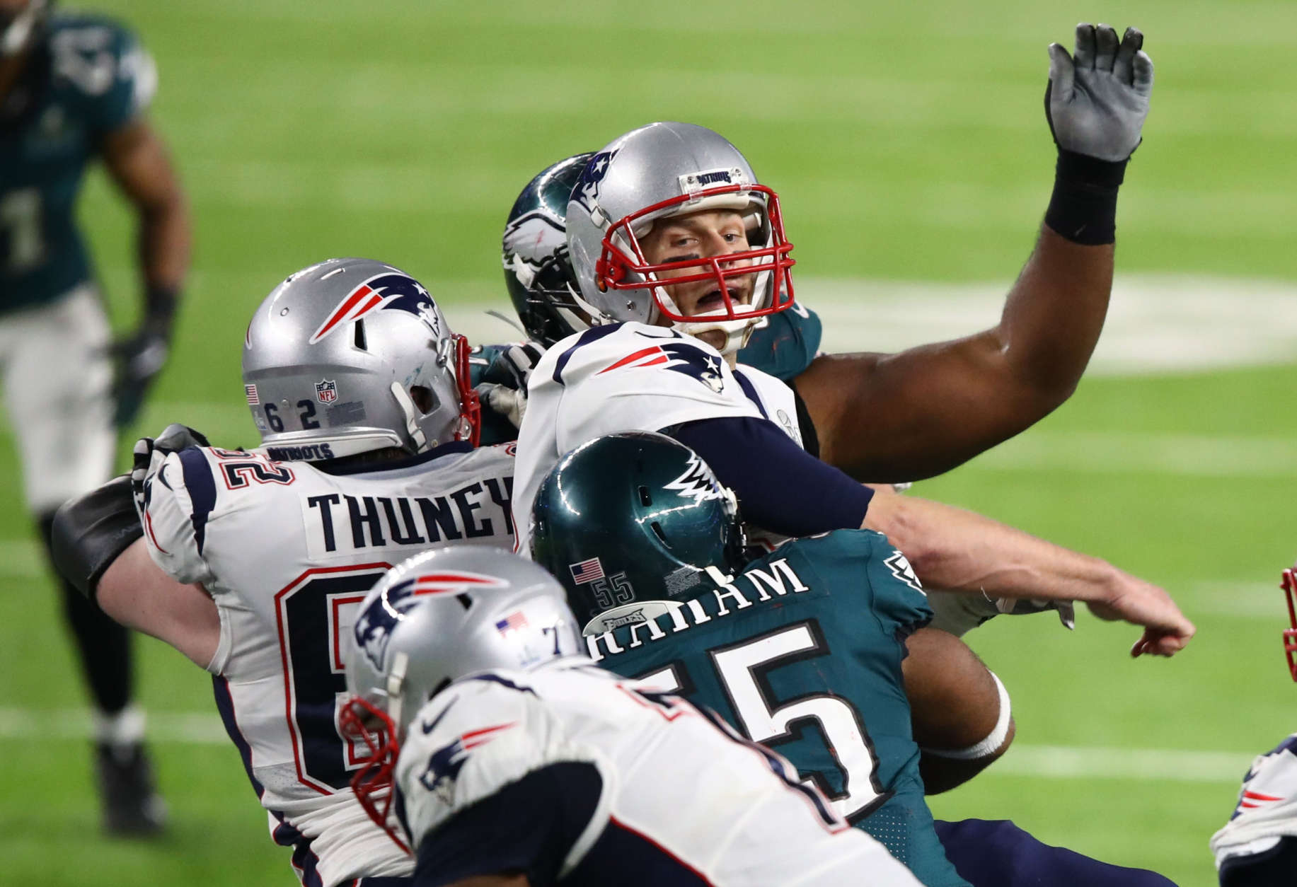 MINNEAPOLIS, MN - FEBRUARY 04: Brandon Graham #55 of the Philadelphia Eagles forces a fumble against Tom Brady #12 of the New England Patriots during the fourth quarter in Super Bowl LII at U.S. Bank Stadium on February 4, 2018 in Minneapolis, Minnesota.  (Photo by Gregory Shamus/Getty Images)
