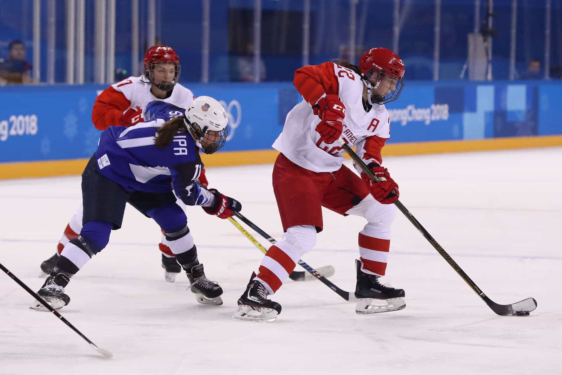 GANGNEUNG, SOUTH KOREA - FEBRUARY 13:  Maria Batalova #22 of Olympic Athlete from Russia battles for the puck with Haley Skarupa #11 of the United States in the first period during the Women's Ice Hockey Preliminary Round - Group A game on day four of the PyeongChang 2018 Winter Olympic Games at Kwandong Hockey Centre on February 13, 2018 in Gangneung, South Korea.  (Photo by Ronald Martinez/Getty Images)