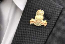 A Fraternal Order of Police pin worn at the funeral for Cpl. Mujahid Ramzziddin. (WTOP/Kate Ryan)
