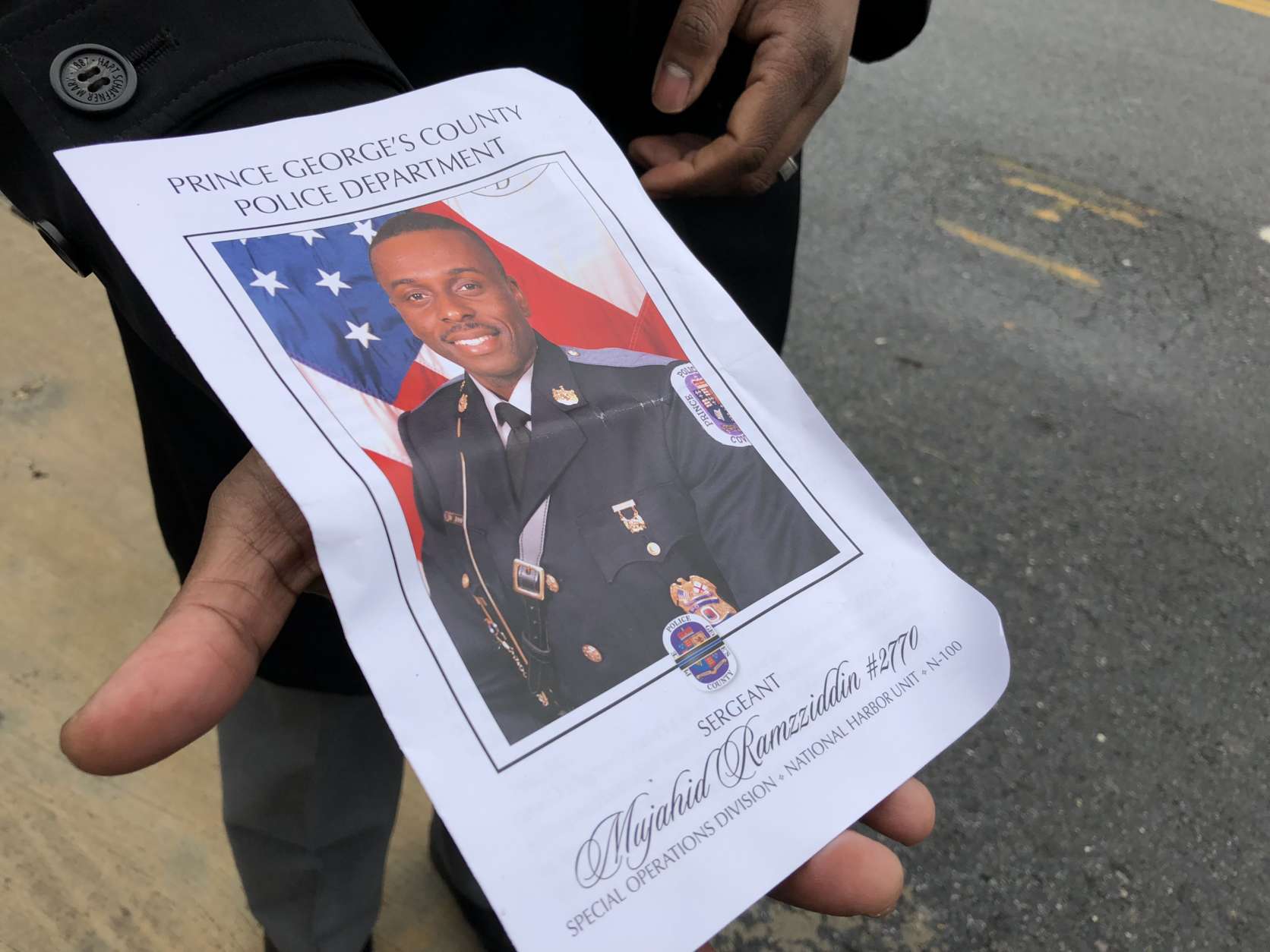 A funeral program for Cpl. Mujahid Ramzziddin. (WTOP/Kate Ryan)