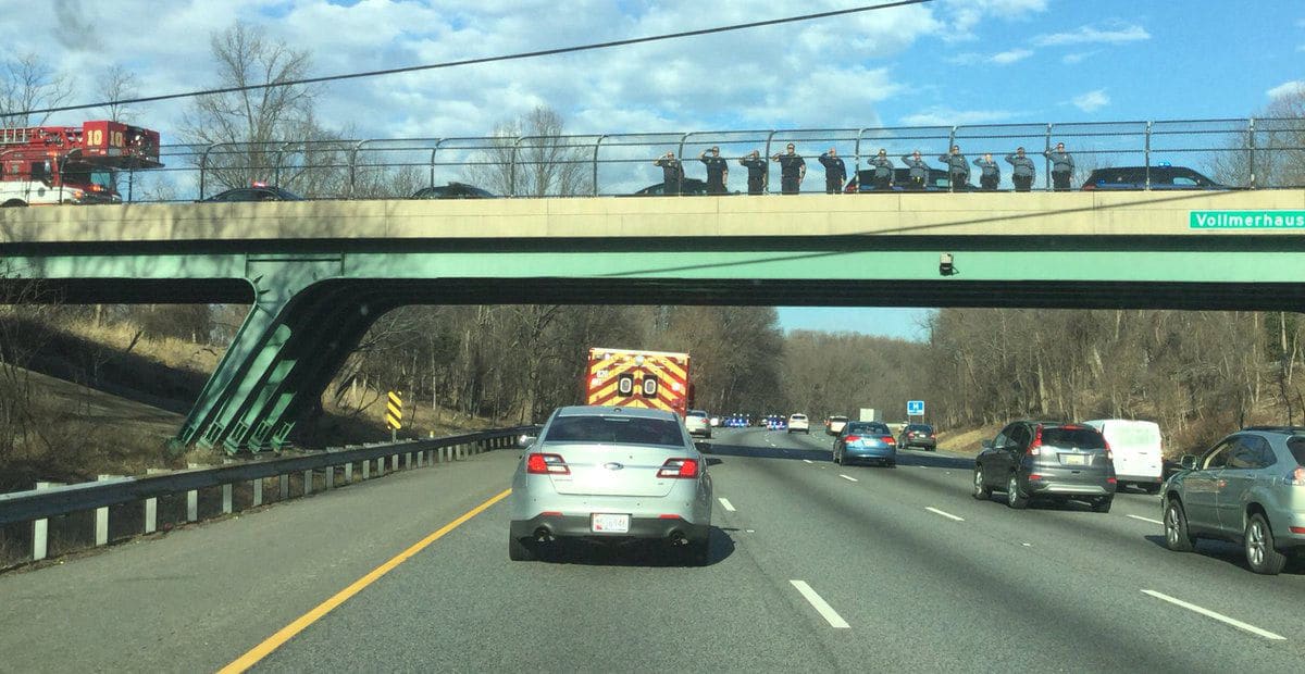 First responders line up to salute the procession of Prince George's County police cars transporting the body of Corporal Mujahid Ramzzidin to Baltimore. (Courtesy Prince George's County Police Department via Twitter)