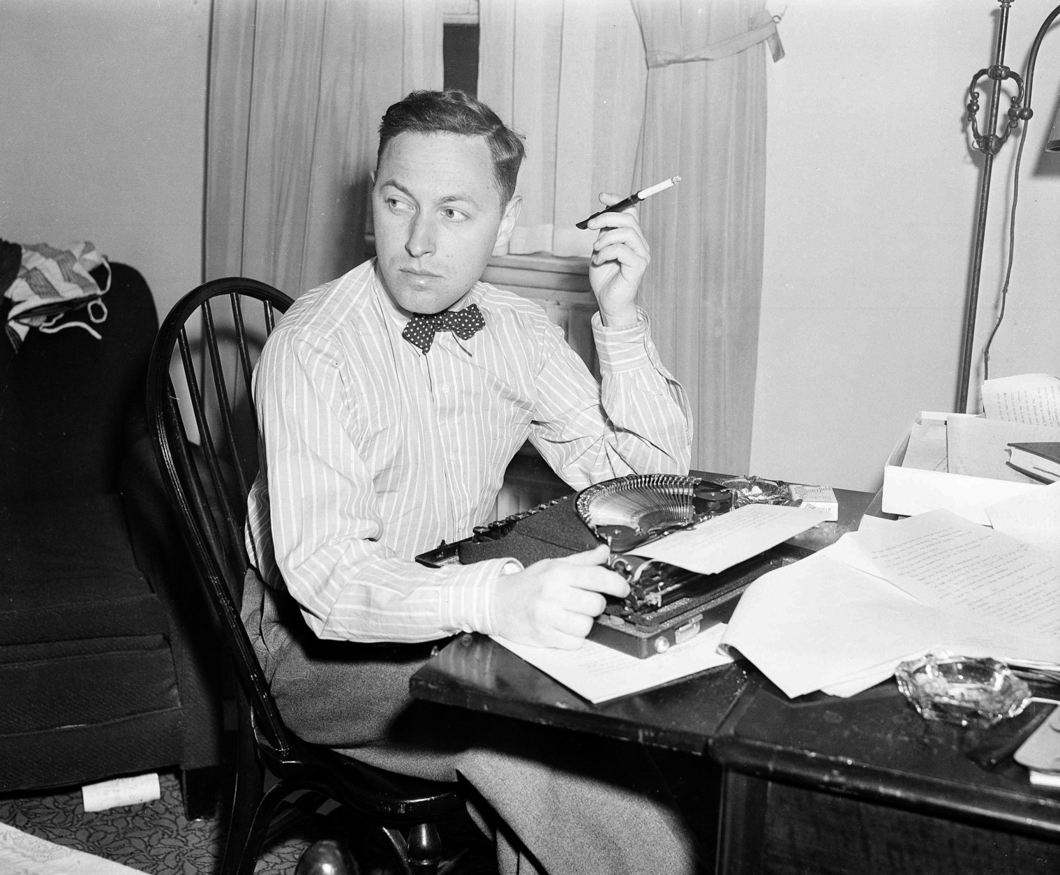 FILE - This Nov. 11, 1940 file photo shows playwright Tennessee Williams at his typewriter in New York.  Williams The Eye That Saw Death, will appear in the spring issue of The Strand Magazine.   The Eye That Saw Death has a fable-like quality even as its plot recalls Poes The Tell-Tale Heart.  (AP Photo/Dan Grossi, File)