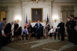 President Donald Trump hosts a listening session with high school students, teachers, and others in the State Dining Room of the White House in Washington, Wednesday, Feb. 21, 2018. (AP Photo/Carolyn Kaster)