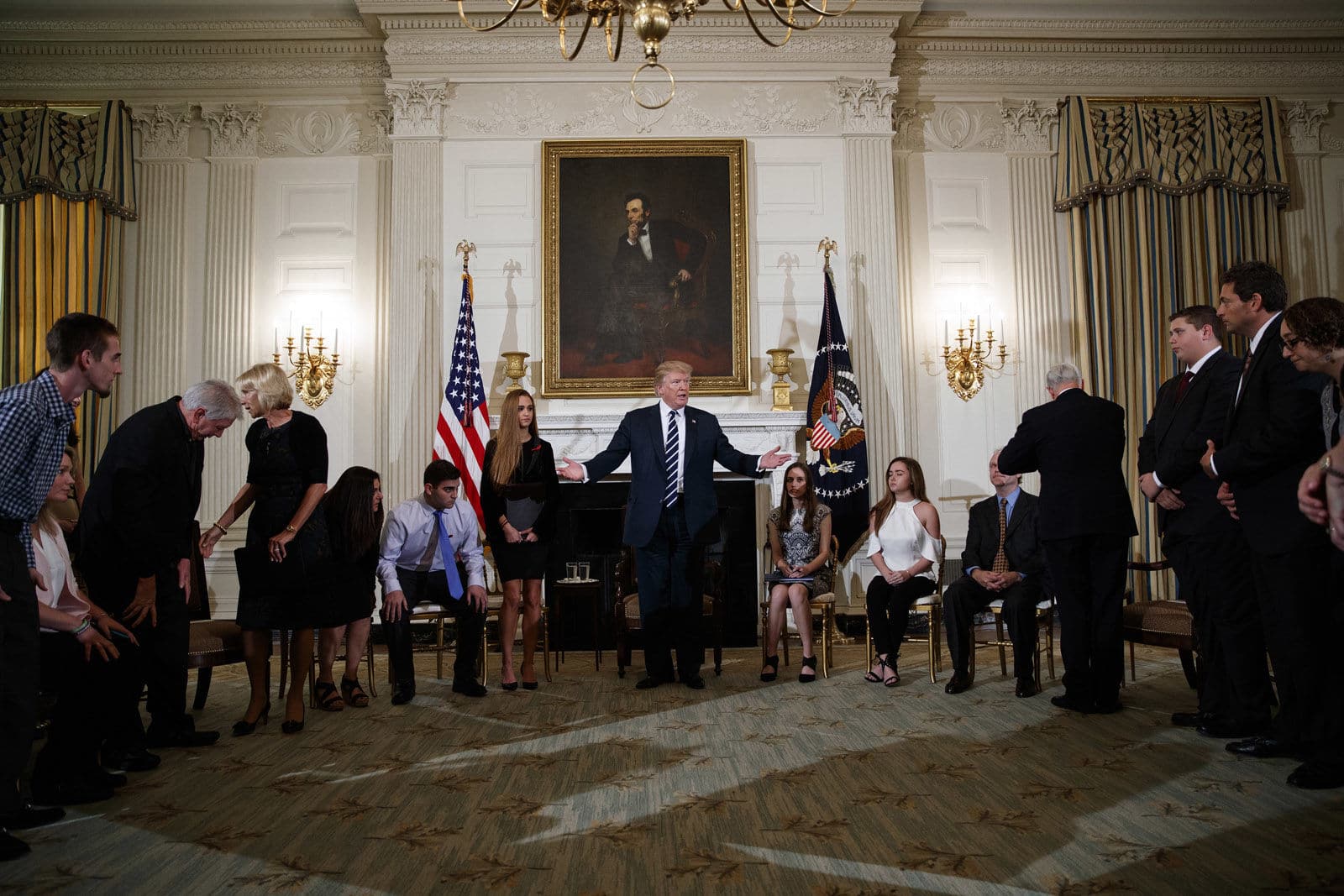 President Donald Trump hosts a listening session with high school students, teachers, and others in the State Dining Room of the White House in Washington, Wednesday, Feb. 21, 2018. (AP Photo/Carolyn Kaster)