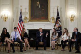 President Donald Trump speaks as he hosts a listening session with high school students, teachers and parents in the State Dining Room of the White House in Washington, Wednesday, Feb. 21, 2018. (AP Photo/Carolyn Kaster)