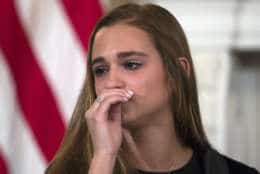 Julia Cordover, the student body president at Marjory Stoneman Douglas High School in Parkland, Fla., cries during listening session with high school students and teachers and President Donald Trump in the State Dining Room of the White House in Washington, Wednesday, Feb. 21, 2018. (AP Photo/Carolyn Kaster)